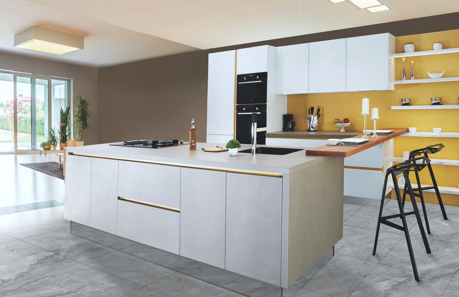 Fitted kitchen island with a pale worktop, hob and tiled floor